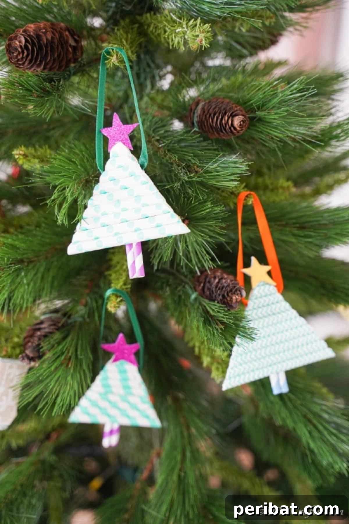 Ornaments made from paper straws hanging on the Christmas tree