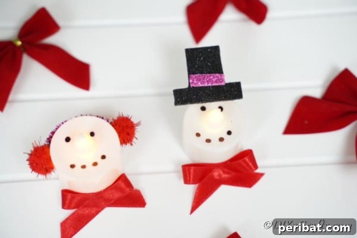 Santa and snowman Christmas candles, beautifully adorned with red bows, arranged on a white board