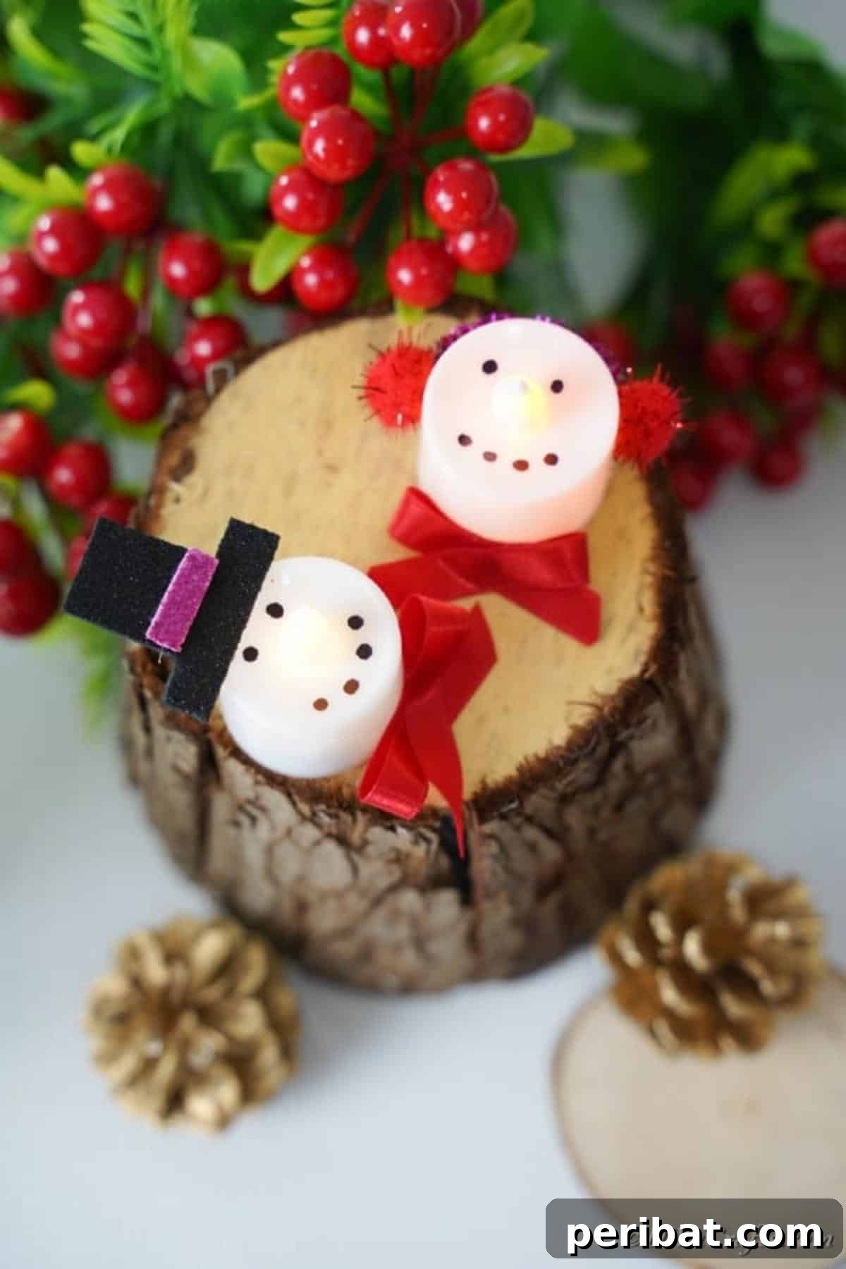 Snowman and Santa candles elegantly arranged on a rustic slice of wood, surrounded by complementary holiday decorations