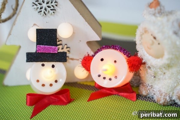 Close up picture of snowman and santa christmas candles
