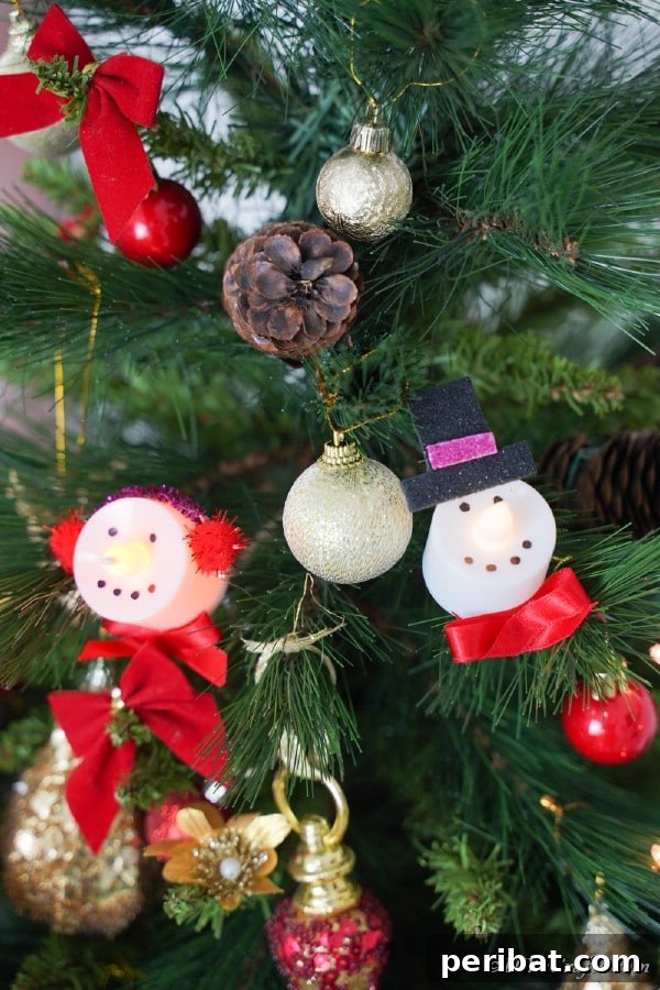 Santa and Snowman Christmas candles on a holiday tree