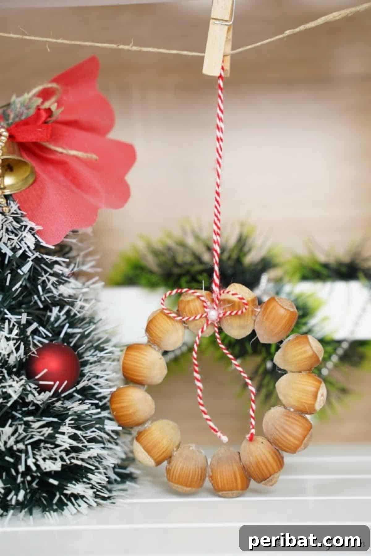 Handmade Rustic Hazelnut Christmas Ornaments 11 A stunning rustic hazelnut Christmas ornament elegantly hanging from a rope, perfectly complementing a festive holiday tree.