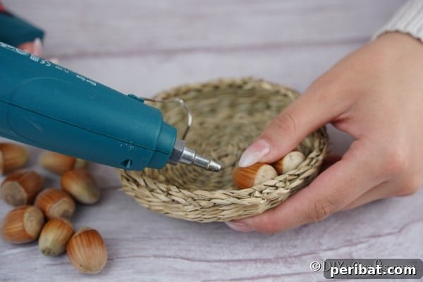 Handmade Rustic Hazelnut Christmas Ornaments 13 Gluing the hazelnuts together to form an ornament