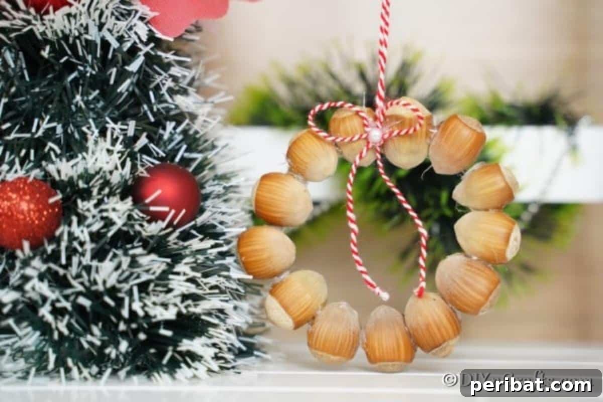 Handmade Rustic Hazelnut Christmas Ornaments 5 A rustic hazelnut Christmas decoration elegantly placed alongside other traditional Christmas tree decor, emphasizing its natural charm.