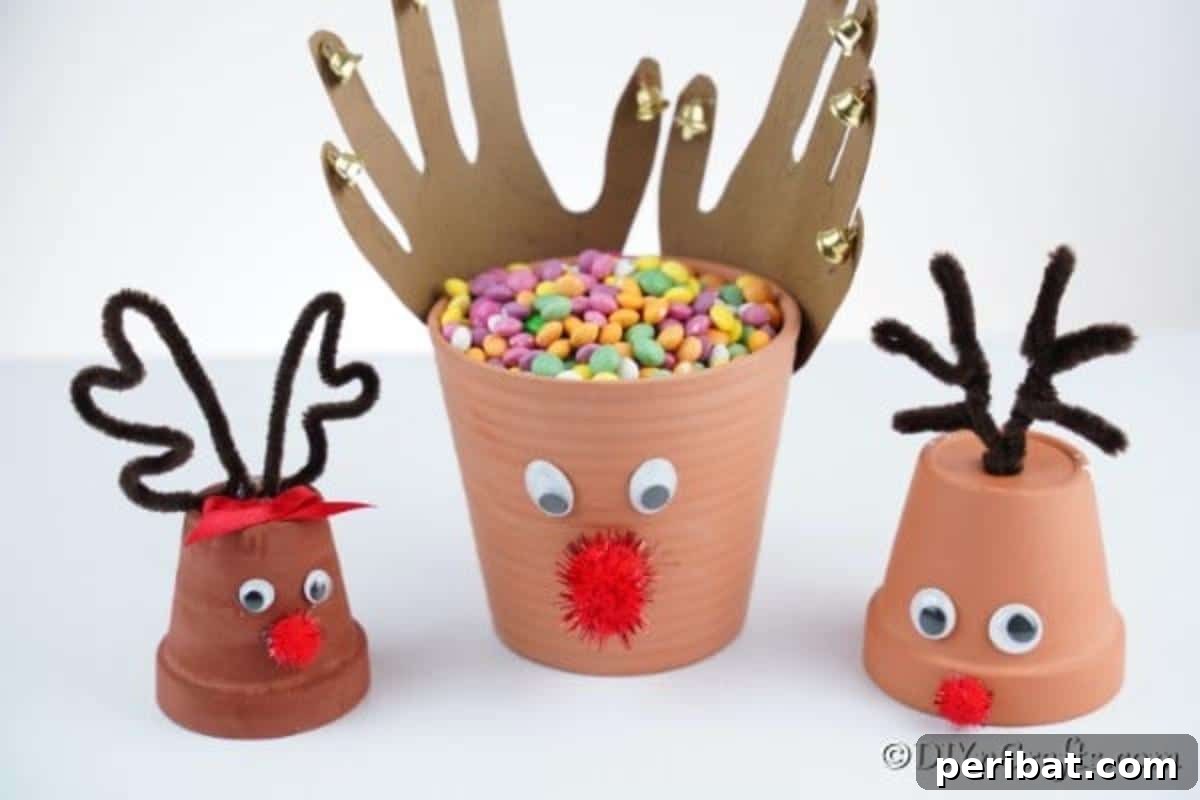 Whimsical Clay Pot Reindeer Christmas Creations 5 A delightful trio of handmade reindeer flower pot decorations, featuring varying sizes and antler designs, arranged artistically on a clean white surface, showcasing their unique charm and festive appeal.