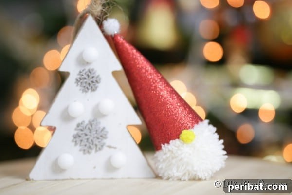 Cozy Pom-Pom Gnomes: Whimsical Holiday Tree Charms 24 Christmas gnome ornament sitting next to a white holiday tree decoration