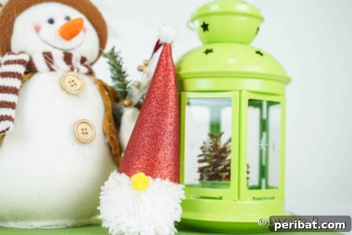 Cozy Pom-Pom Gnomes: Whimsical Holiday Tree Charms 5 A simple Christmas gnome leaning against a green lantern