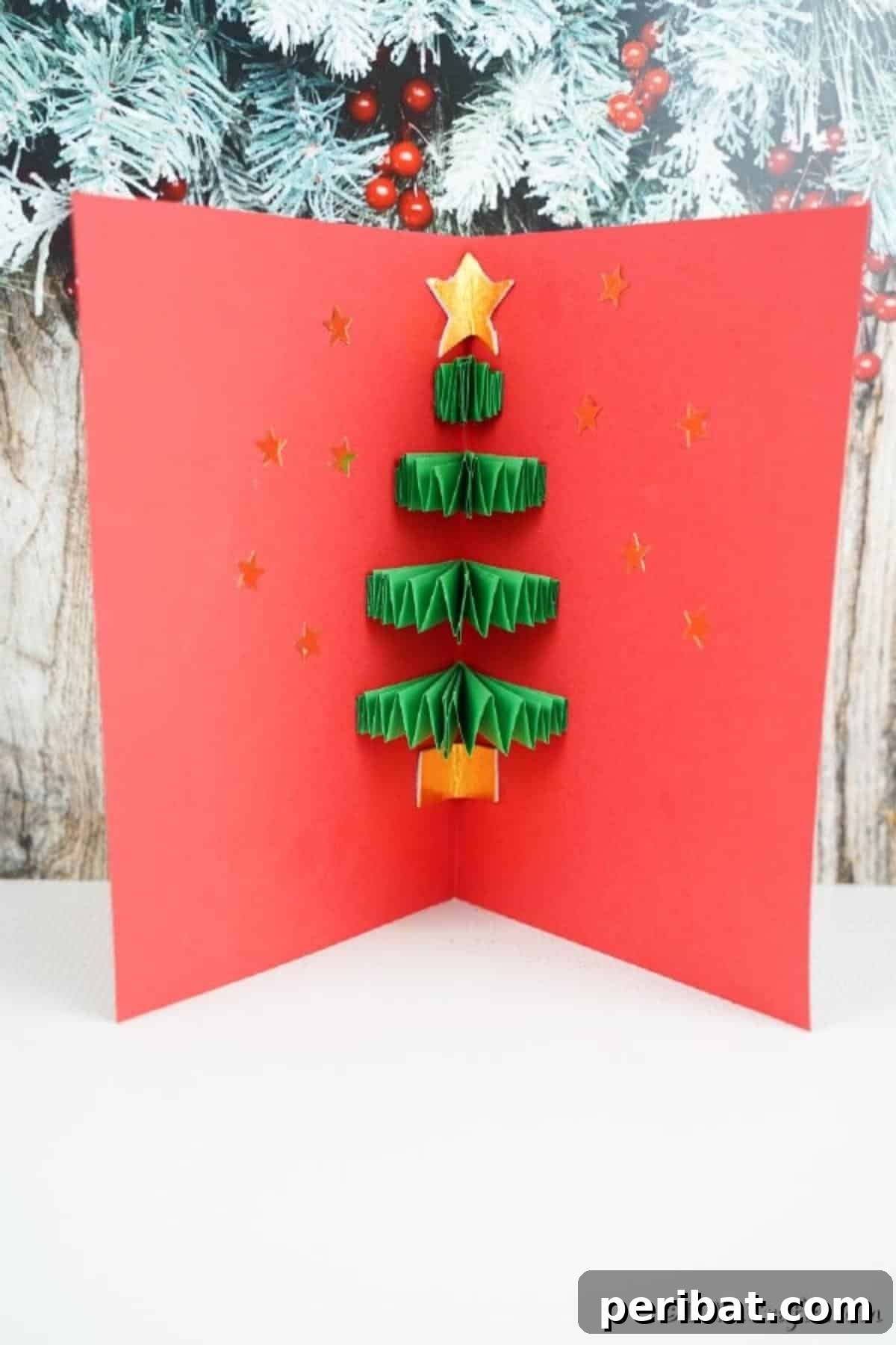 A 3D Christmas tree card displayed on a white shelf