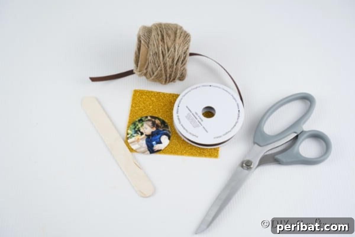 Sweet Memories: Craft Stick Photo Lollipops 6 A neatly arranged collection of supplies needed to craft a lollipop photo ornament, including a craft stick, ribbons, glitter paper, scissors, glue gun, and a photograph.