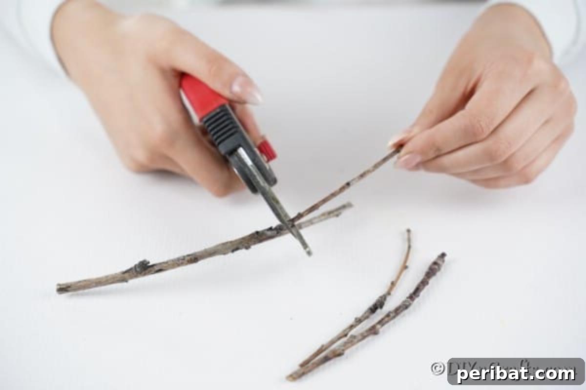 Trimming twigs to make holiday ornaments