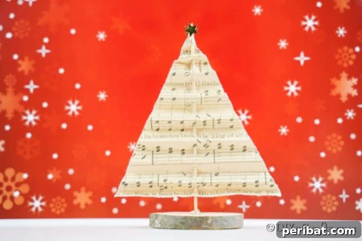 Melody-Folded Christmas Tree 3 A sheet music paper Christmas tree displayed on a table with a warm red holiday background, highlighting its rustic elegance.