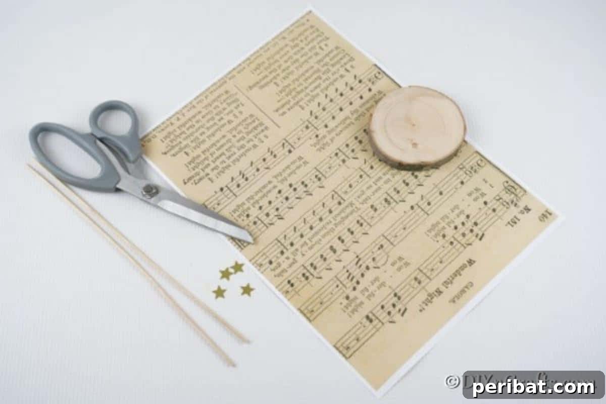 Melody-Folded Christmas Tree 6 A curated collection of supplies for making paper Christmas trees from sheet music, neatly arranged on a white table, ready for crafting.
