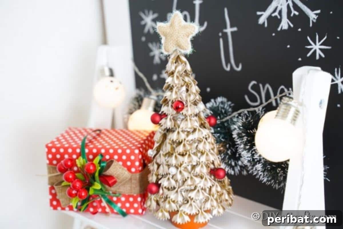 Creative Pasta Christmas Ornaments 3 A beautifully gold painted Christmas tree decoration, meticulously crafted from pasta, elegantly displayed on a mantle amidst other festive holiday decor.