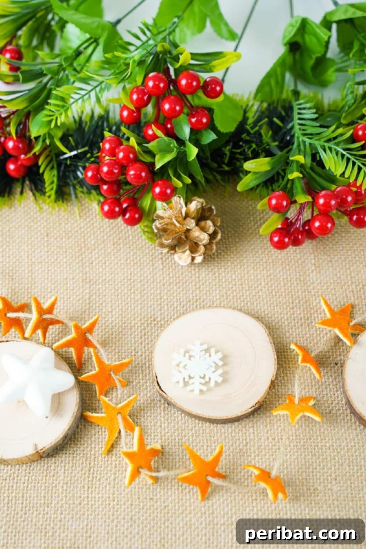 Rustic Chic Orange Peel Star Winter Garland 13 An orange star garland laying on a table with other holiday decorations