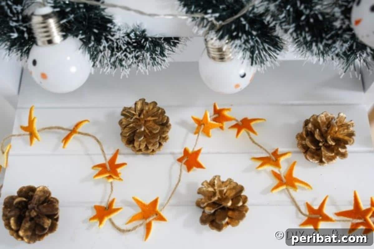 Rustic Chic Orange Peel Star Winter Garland 3 Orange peel star garland displayed on a white table with other holiday decor pieces