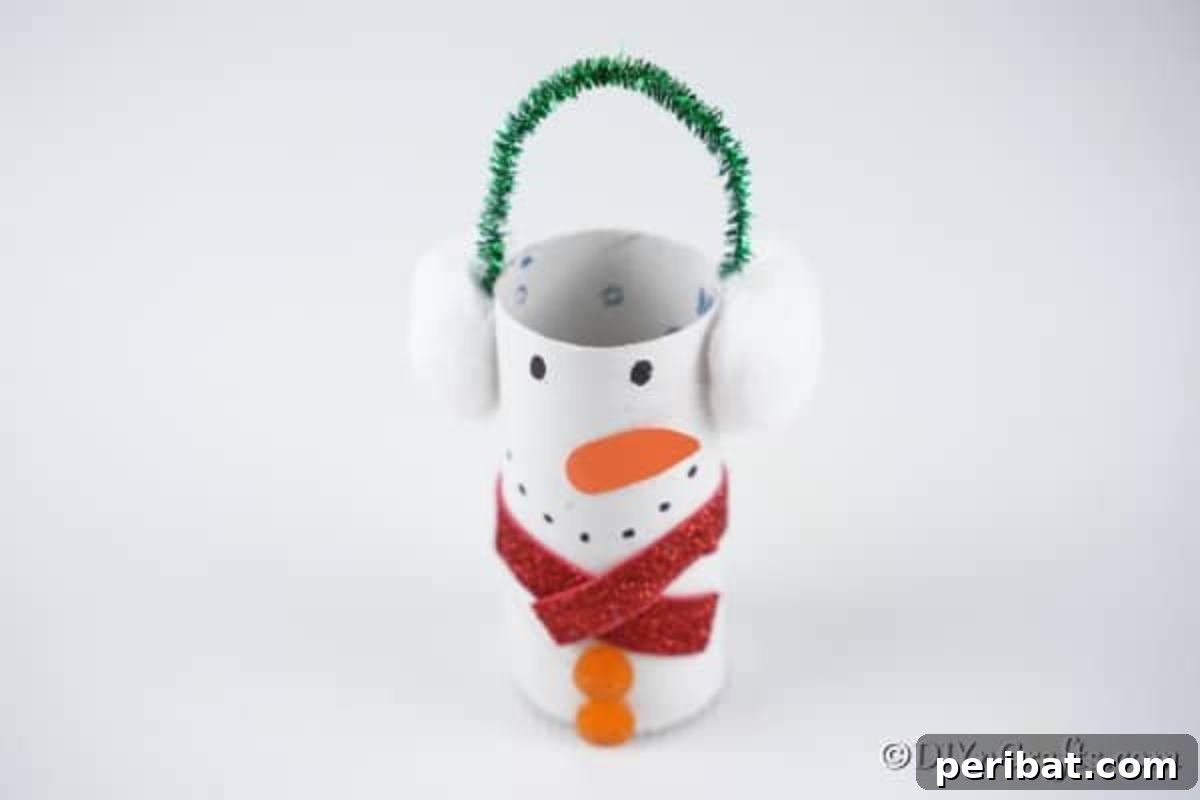 Upcycled Toilet Roll Santa Snowman and Elf for Kids 11 A completed, adorable snowman toilet paper roll craft, showcasing all its festive details and ready for display.