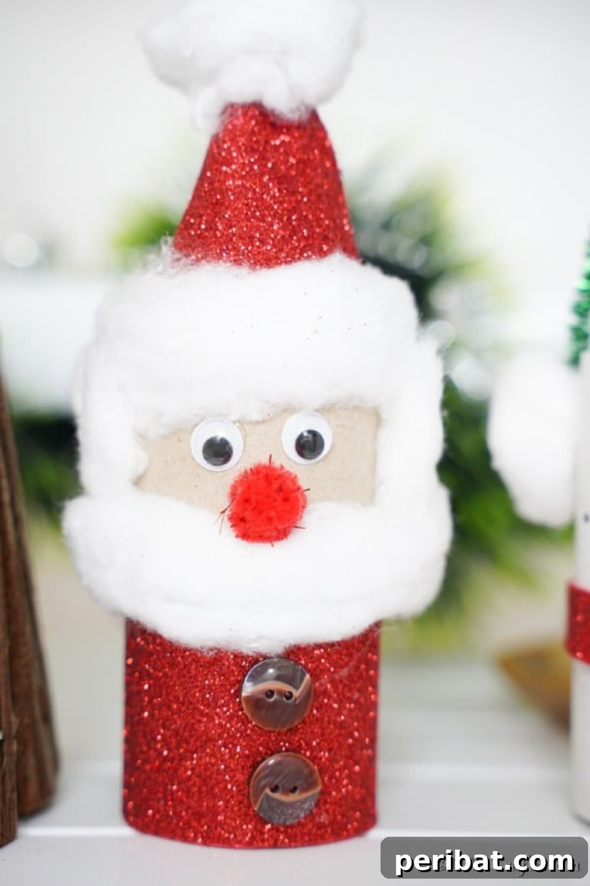 Upcycled Toilet Roll Santa Snowman and Elf for Kids 20 A close-up view of a beautifully crafted Santa toilet paper roll, ready for display during the holiday season.