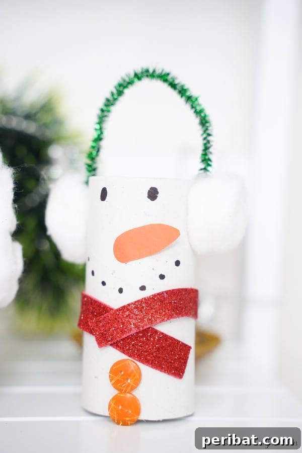 Upcycled Toilet Roll Santa Snowman and Elf for Kids 31 A snowman toilet paper roll craft displayed