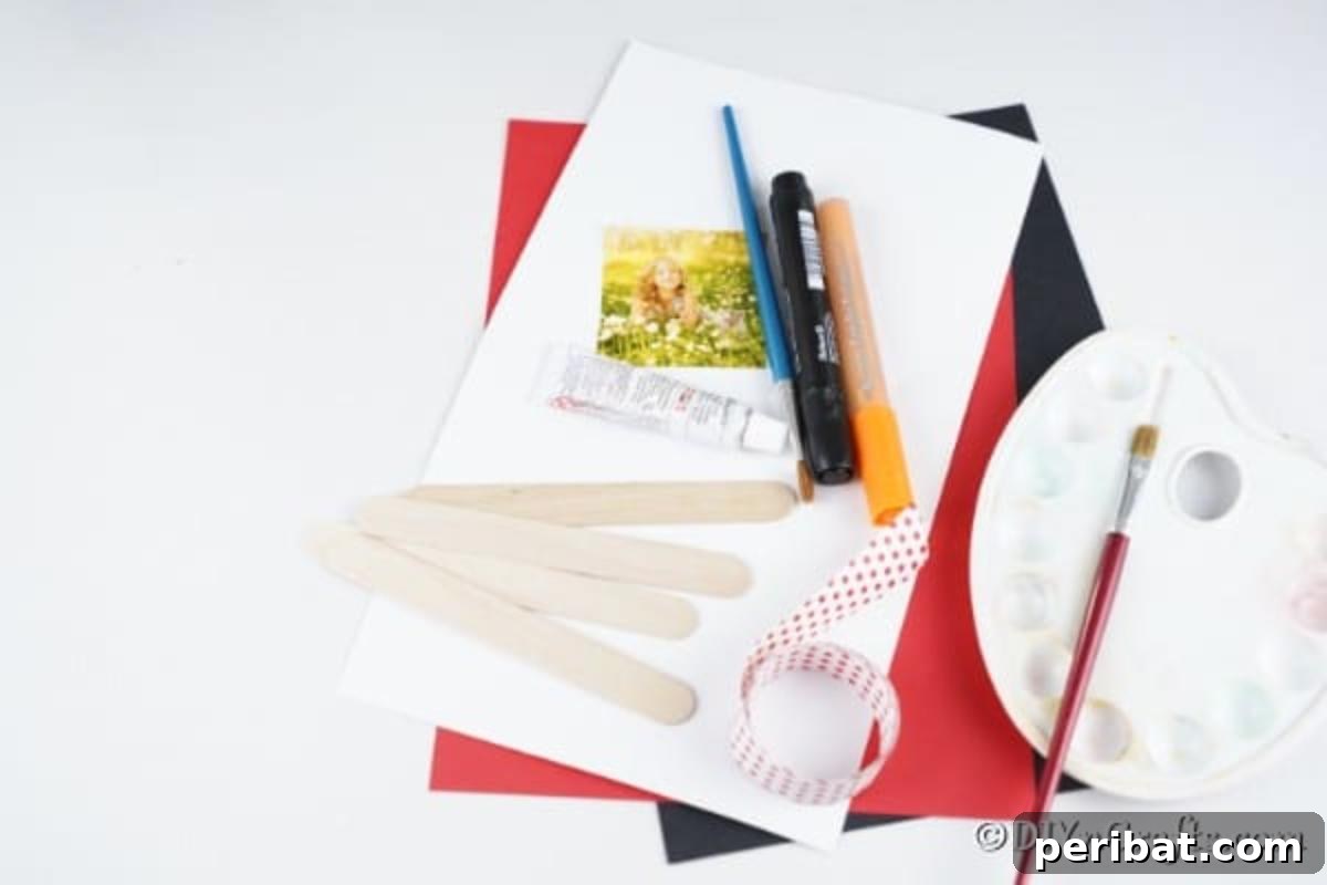 Supplies for making a snowman craft stick ornament