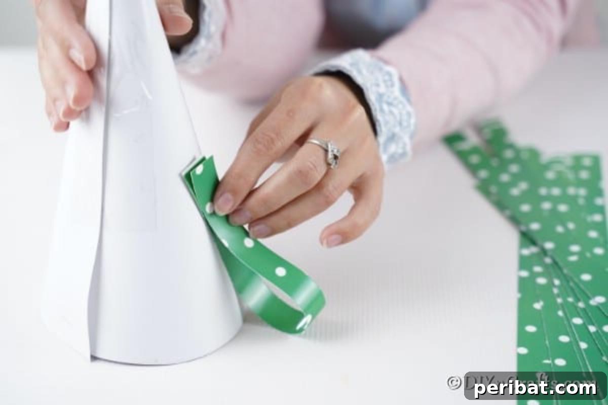 Festive Paper Strip Christmas Tree Delight 11 Gluing paper loops to the mini Christmas tree
