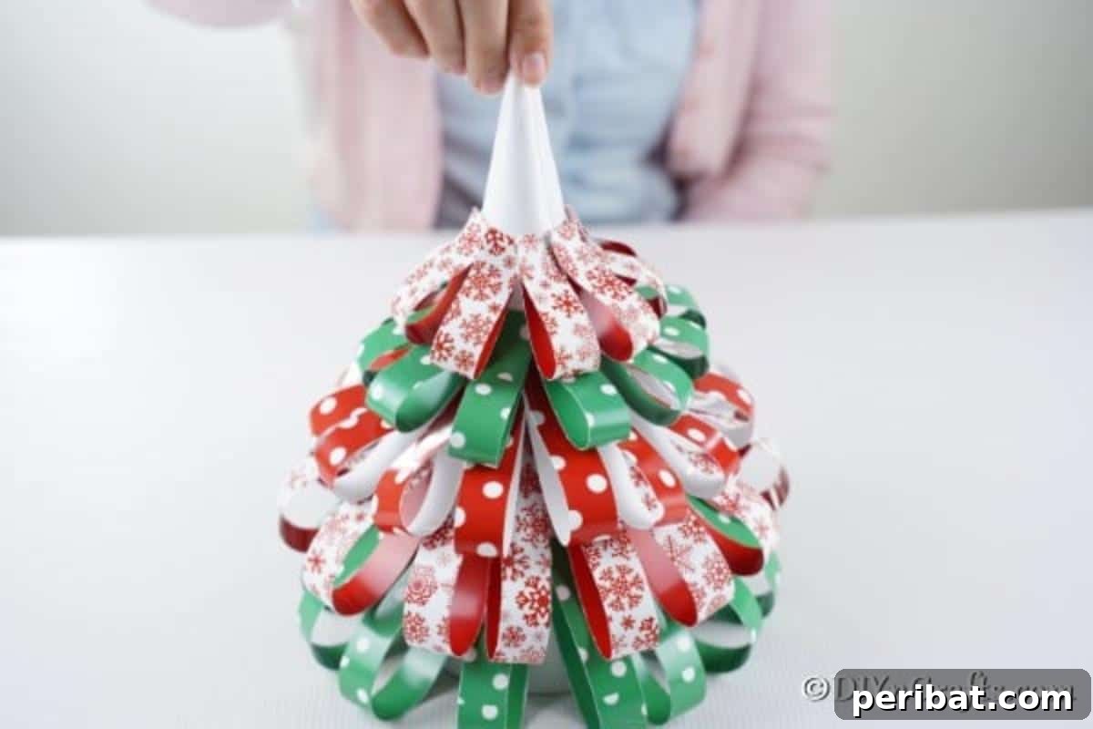 Festive Paper Strip Christmas Tree Delight 14 Adding paper loops to a paper strip Christmas tree