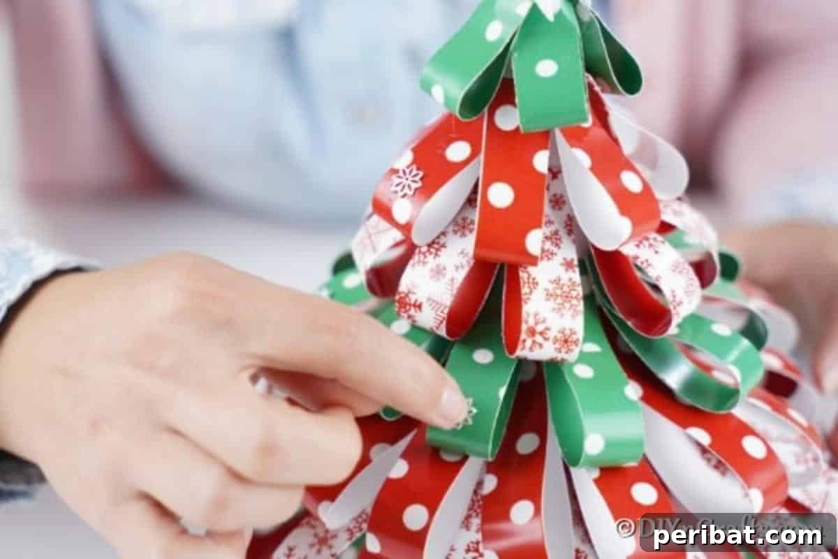 Festive Paper Strip Christmas Tree Delight 16 Adding embellishments to the christmas tree made of craft paper