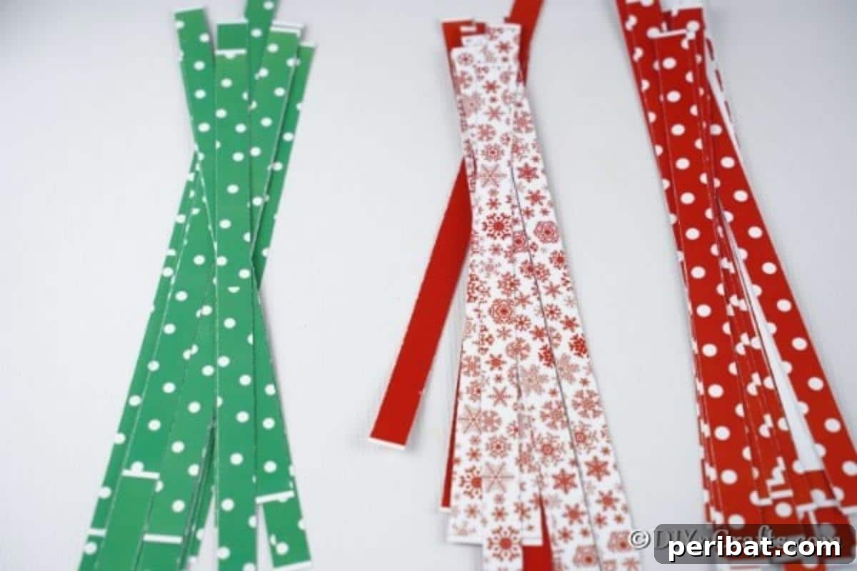 Festive Paper Strip Christmas Tree Delight 10 Several paper strips on a white table for making a mini paper strip christmas tree craft