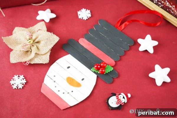 Cute DIY Popsicle Stick Snowman Craft completed