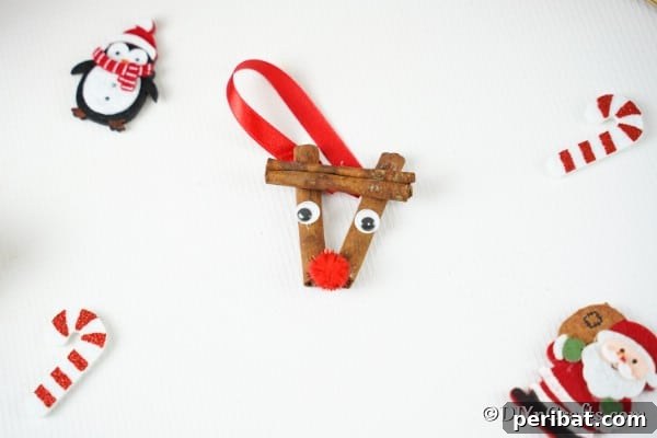 Cinnamon stick reindeer ornaments on a white table