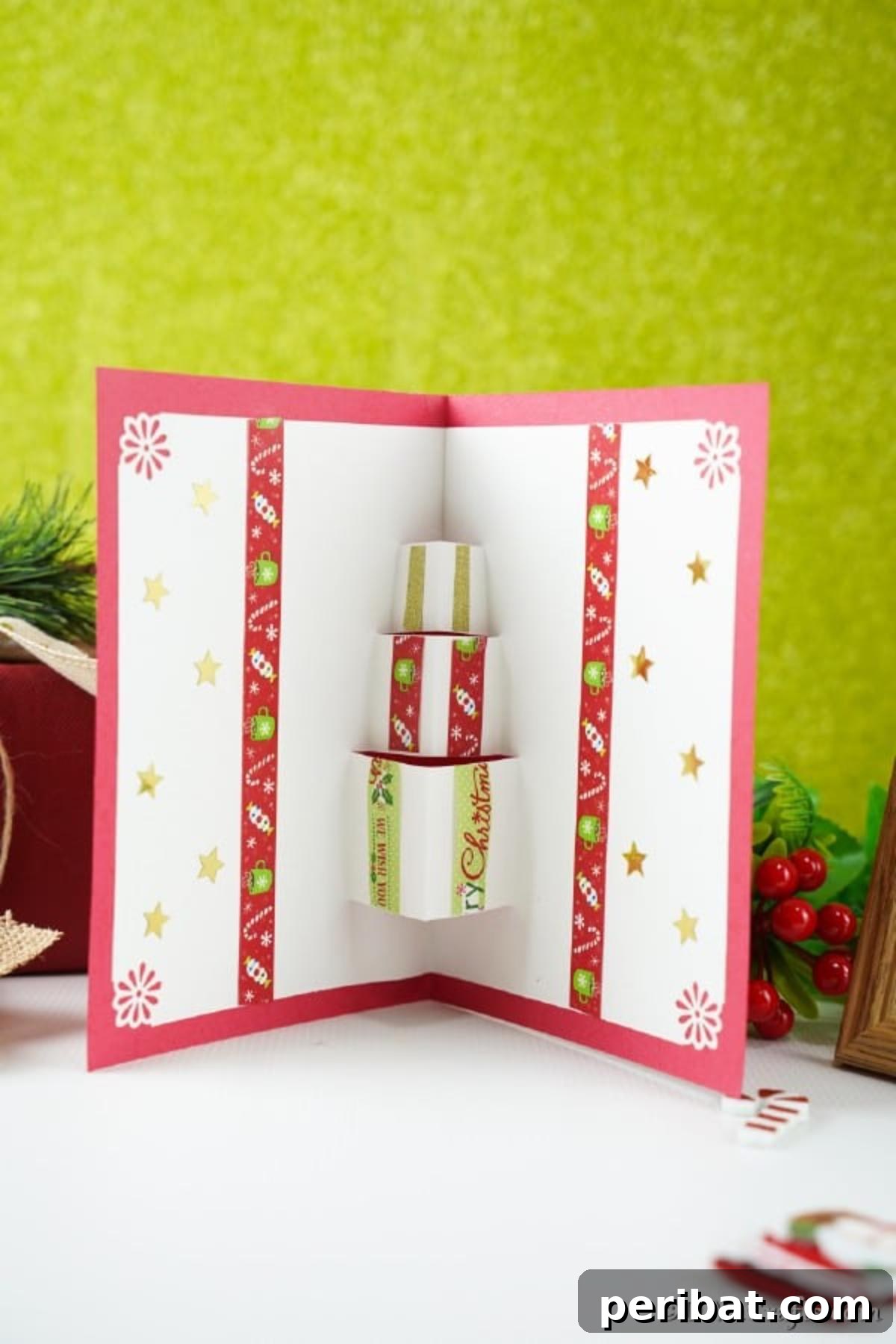 A gift box card sitting on a white counter with green background