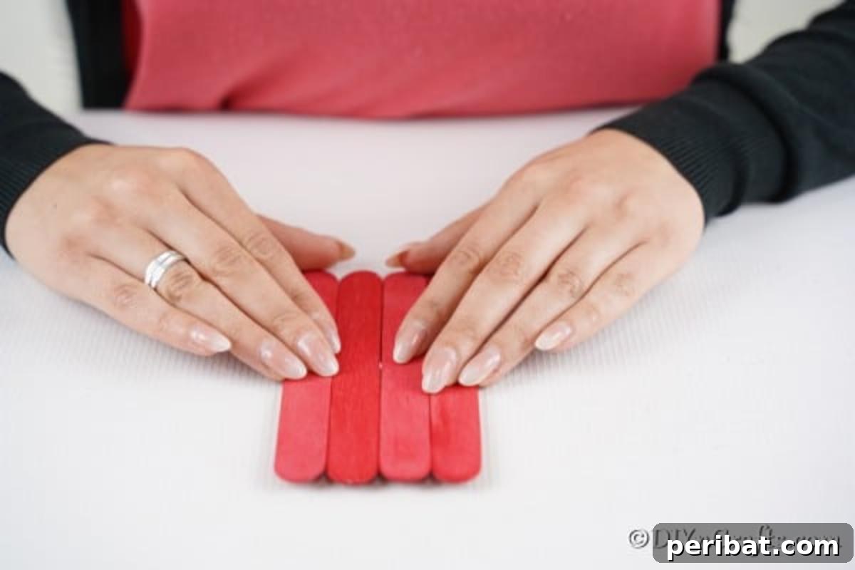 Gluing craft sticks together for popsicle stick Santa claus