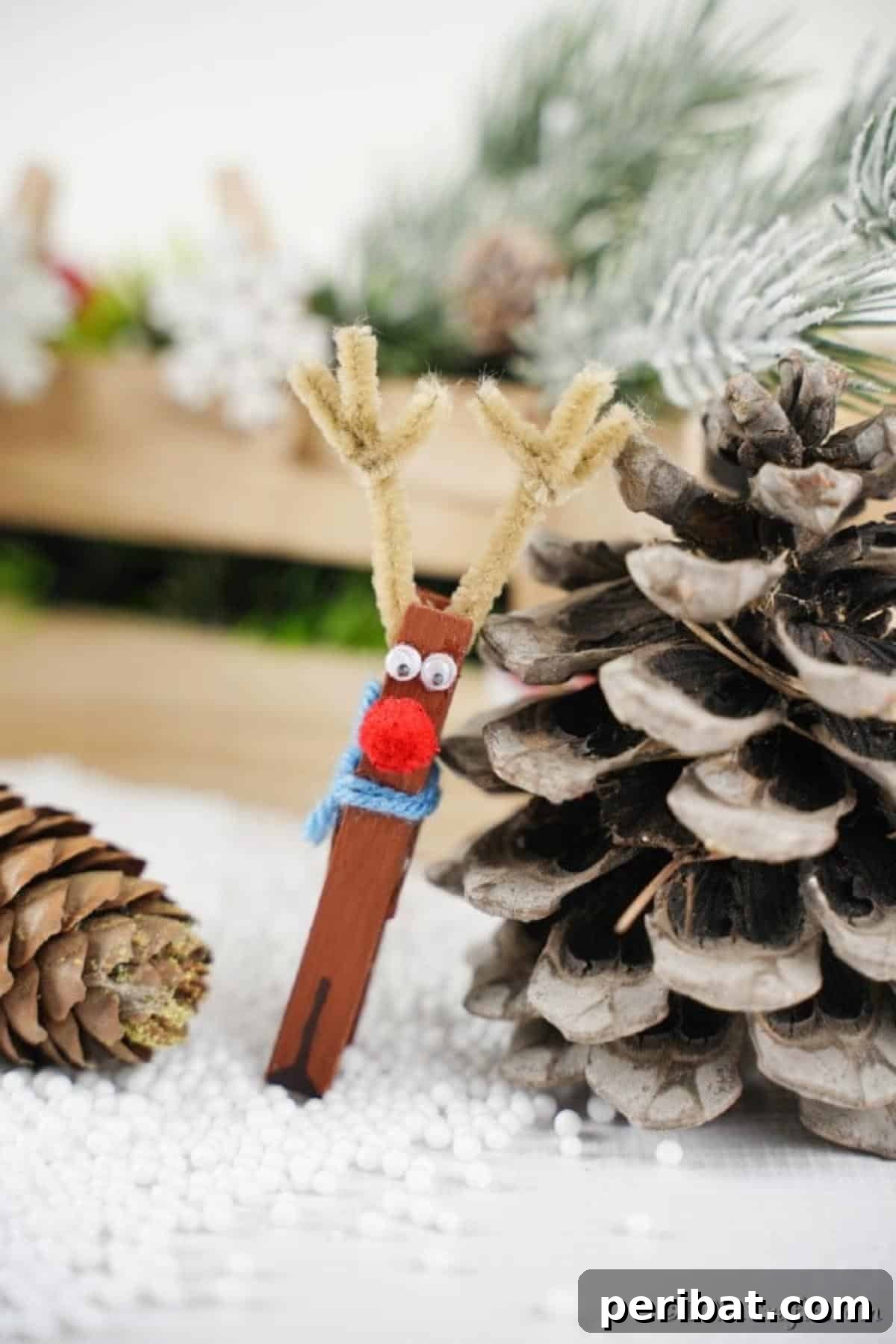 Transform Clothespins Into Adorable Reindeer Ornaments 6 A clothespin reindeer leaning against a pinecone