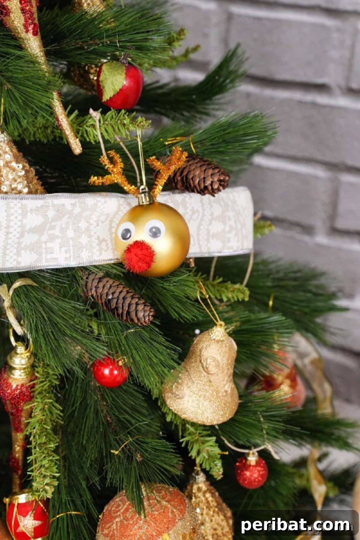 Rudolph's Dazzling Christmas Tree Bauble 11 Shiny Rudolph the Red-Nosed Reindeer Christmas Ornament hanging proudly on a decorated Christmas tree, amidst other festive lights and baubles.
