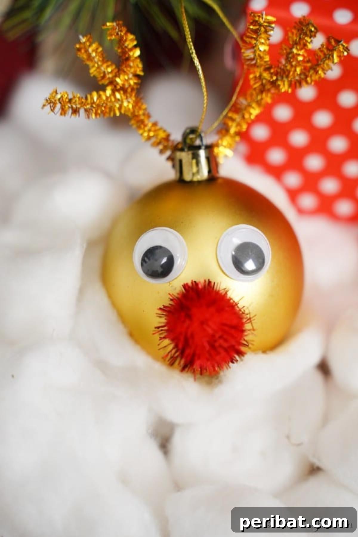 Rudolph's Dazzling Christmas Tree Bauble 4 Close-up of a Shiny Rudolph the Red-Nosed Reindeer Christmas Ornament, highlighting its handcrafted details and festive glow.
