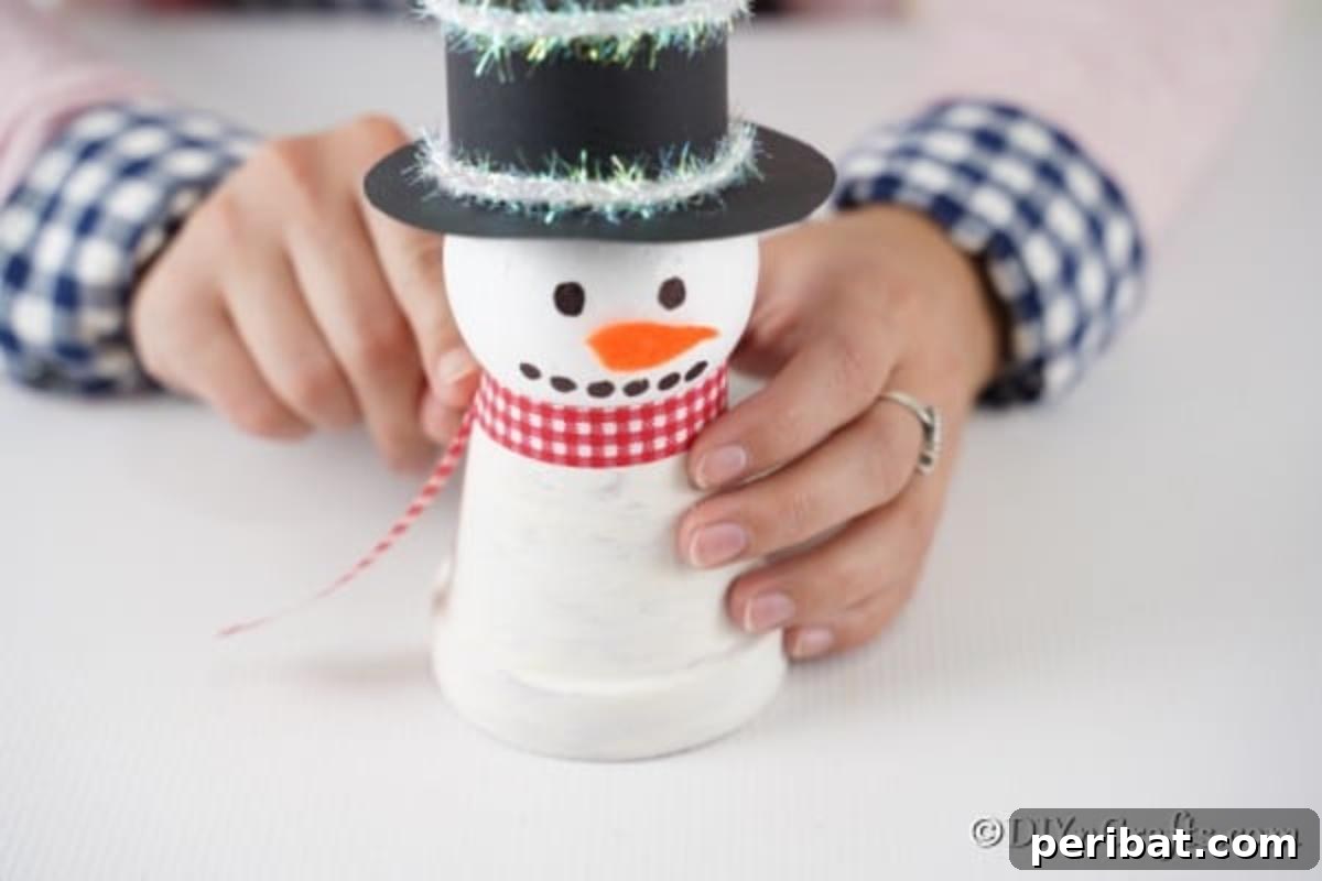 Adding scarf to snowman body