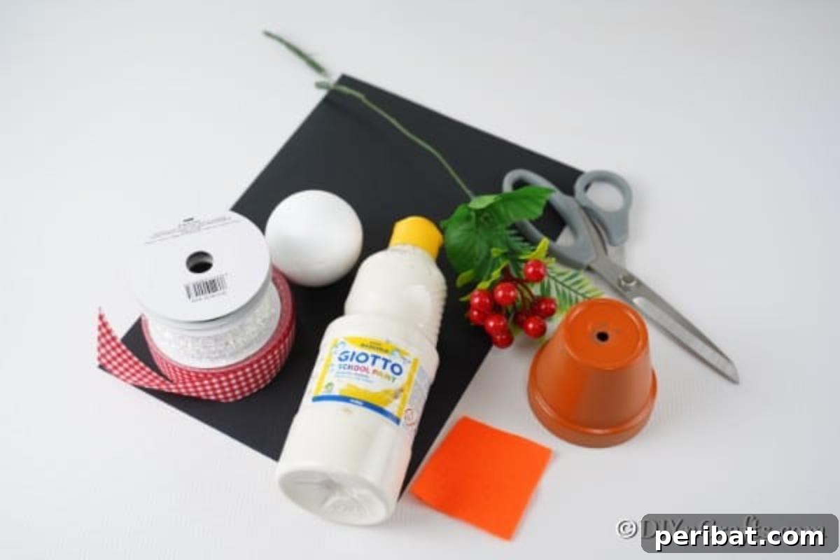 Supplies needed to make a snowman decor for Christmas