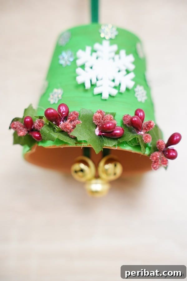 Craft Your Own Adorable Christmas Bell Ornaments 21 A green Christmas bell decoration against white background