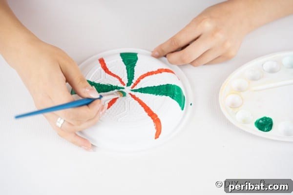 Adding paint lines to plates for making giant lollipops