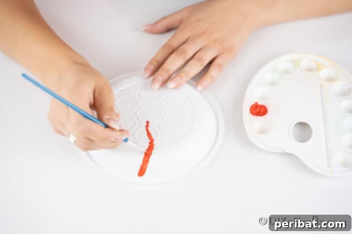 Drawing lines on plastic plates to create a lollipop design