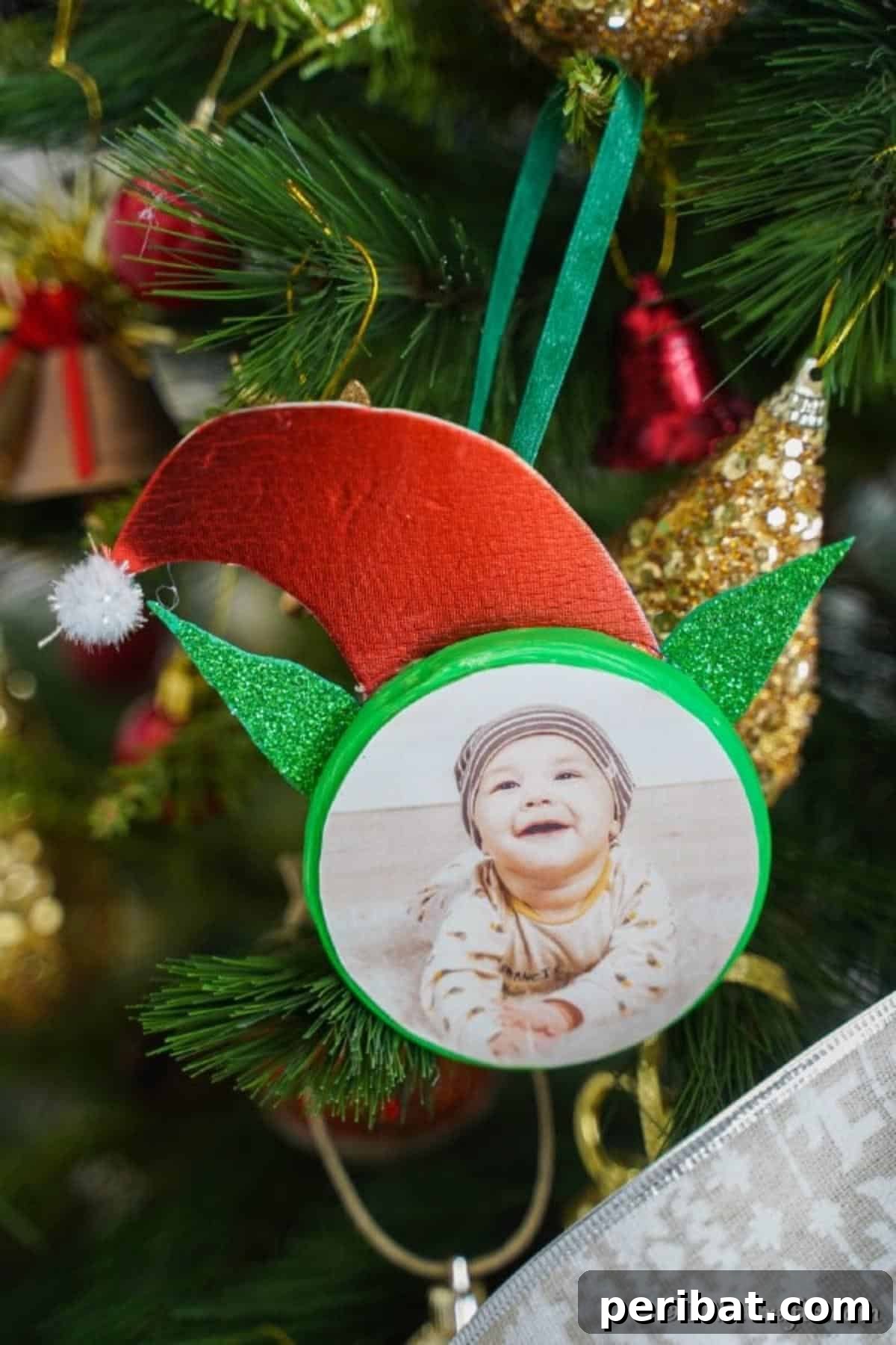 Whimsical Elf Photo Ornaments 11 Up close picture of an elf ornament hanging on a tree