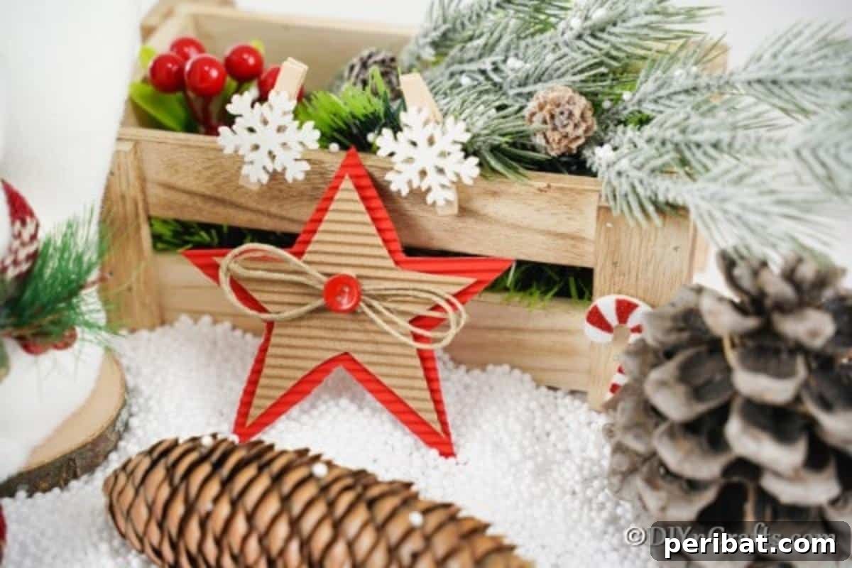 A cardboard Christmas star decoration next to a wooden box filled with holiday decorations