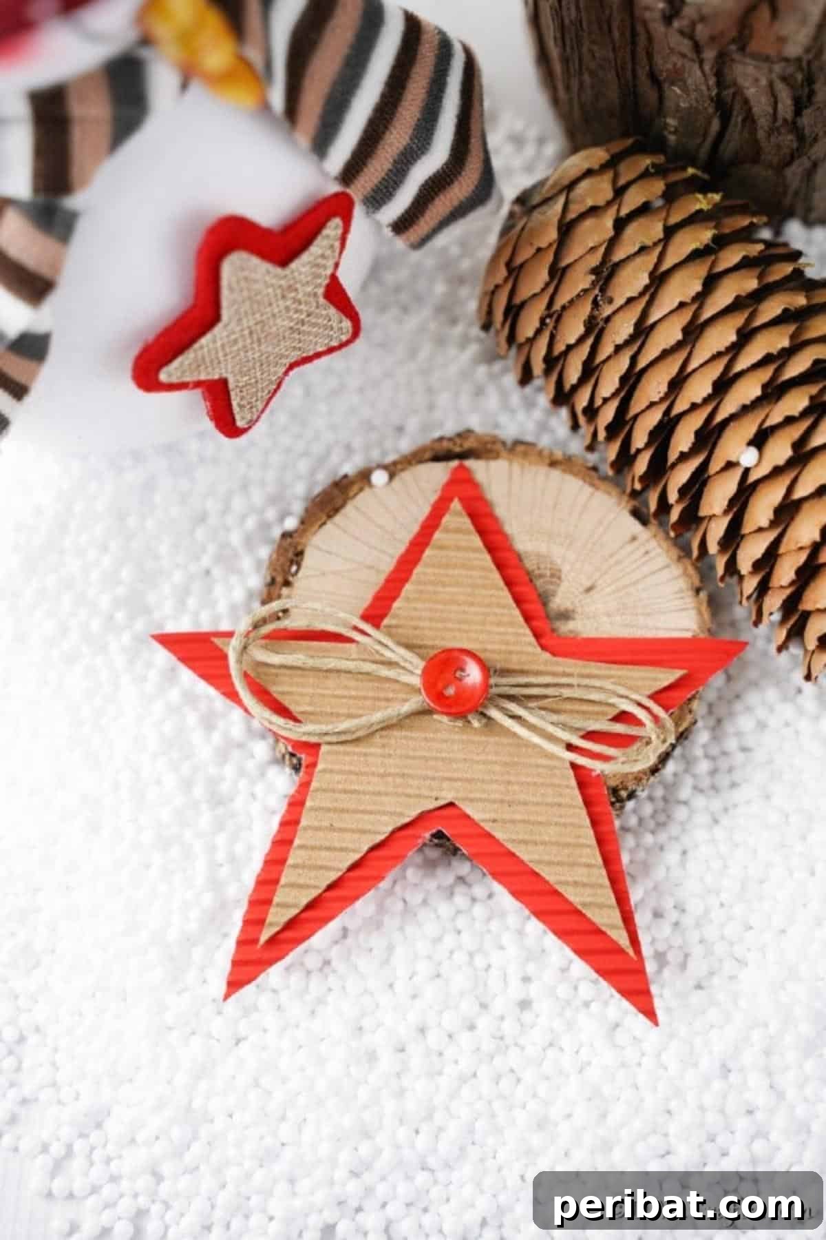 A cardboard Christmas star decoration laying on a white surface