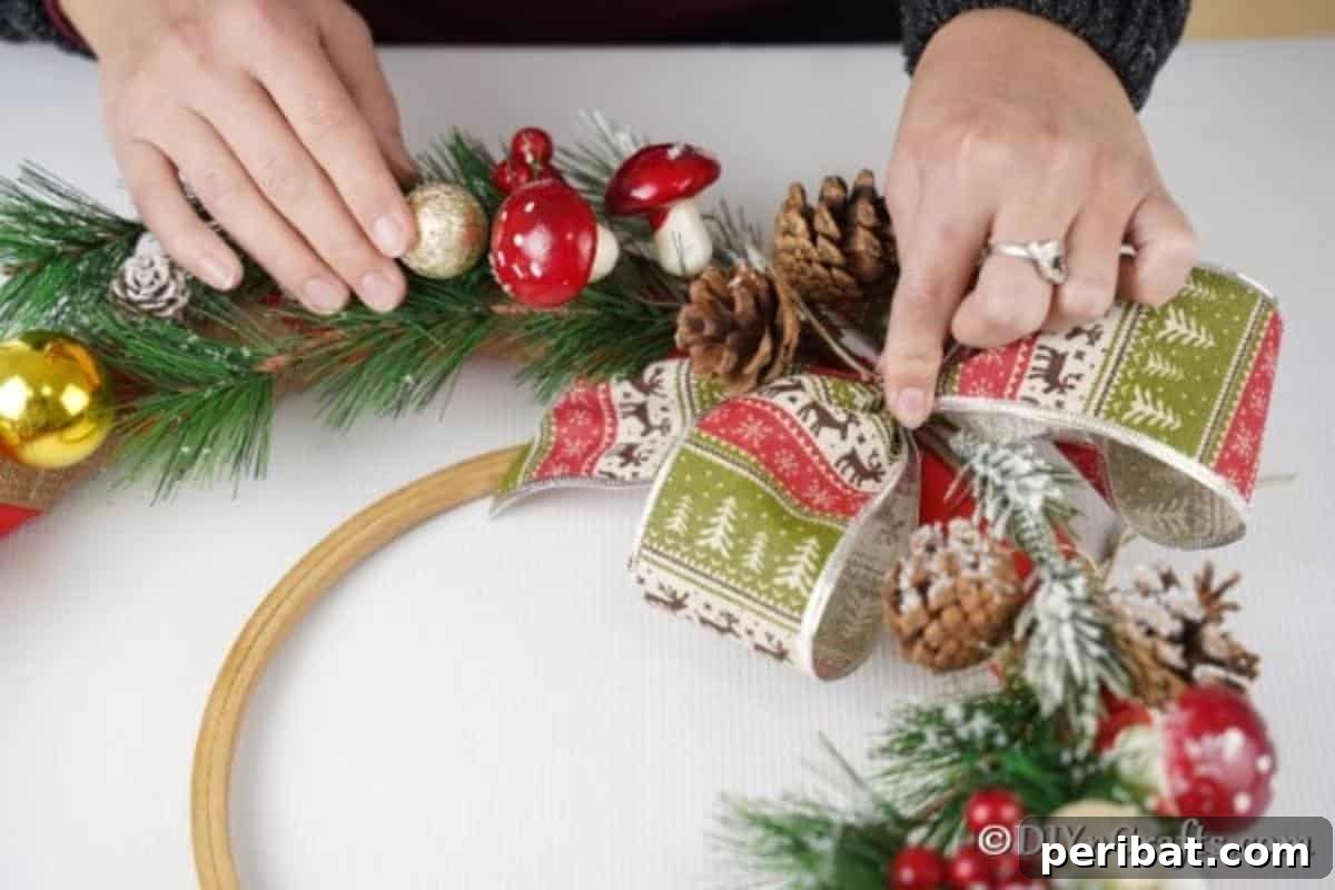 Deck Your Door: DIY Christmas Wreaths 11 Adding a bow to the rustic DIY Christmas wreath