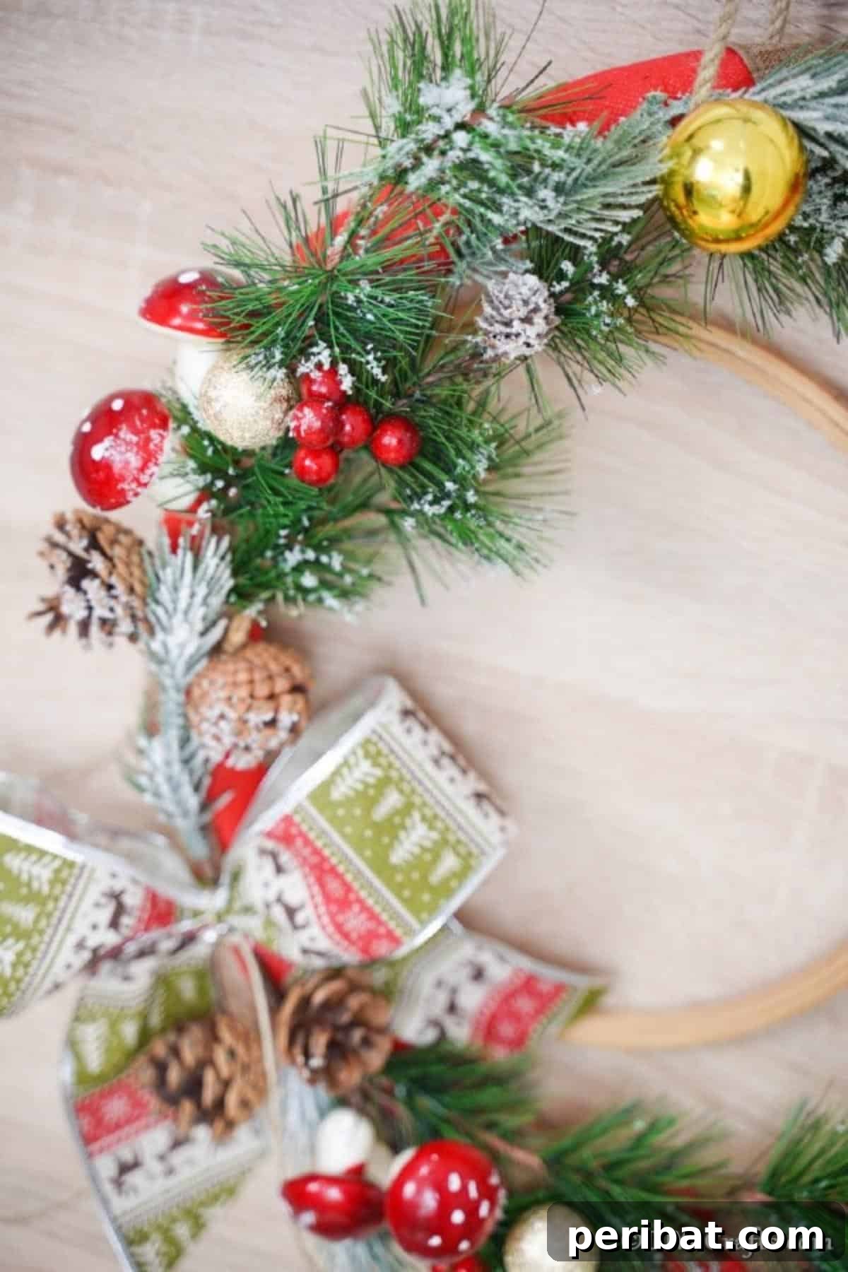Deck Your Door: DIY Christmas Wreaths 12 Up close picture of a DIY Christmas wreath hung on a wall