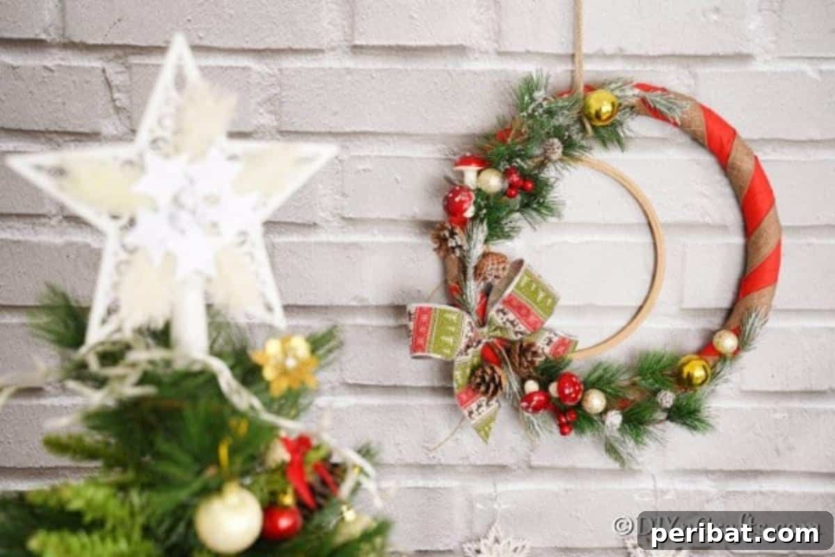 Deck Your Door: DIY Christmas Wreaths 3 A rustic Christmas wreath behind a Christmas tree on a brick wall