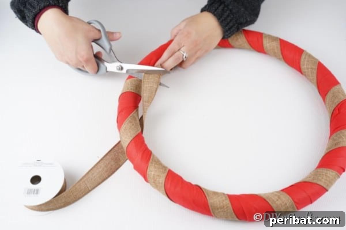 Deck Your Door: DIY Christmas Wreaths 8 Adding a second color of fabric to the rustic Christmas wreath