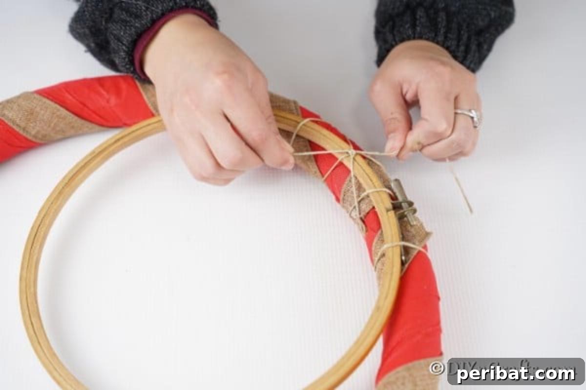 Deck Your Door: DIY Christmas Wreaths 9 Attaching a second wooden frame to the middle of the rustic diy Christmas wreath