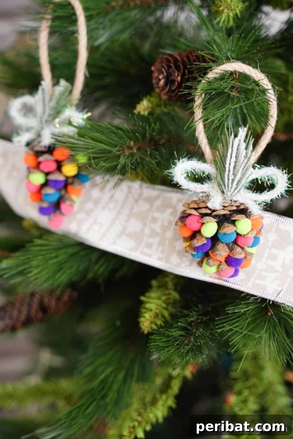 Vibrant Pinecone Christmas Decorations 4 Several colorful pinecone ornaments adorned with pom poms hanging gracefully on a festive Christmas tree.