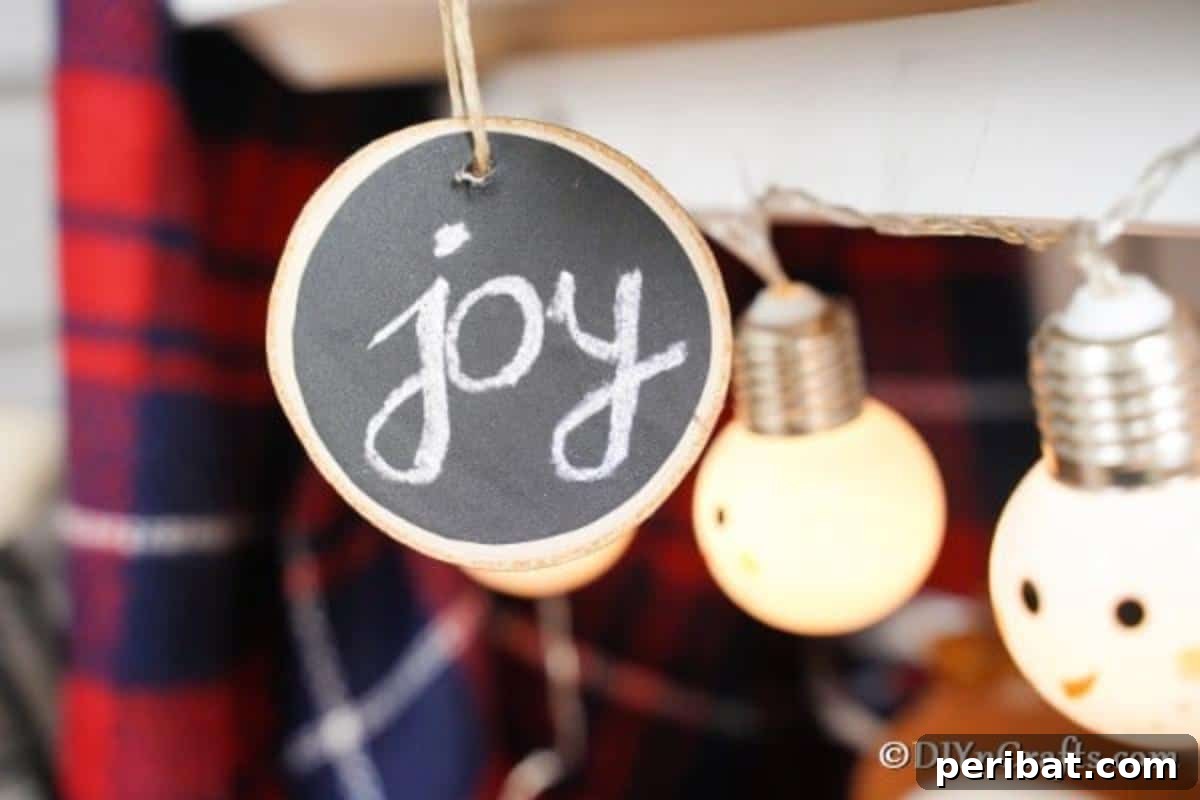 Rustic Wood Slice Chalkboard Charm 3 A beautifully crafted wood slice chalkboard ornament, personalized with a festive message, hanging gracefully amongst other holiday decorations on a rustic mantlepiece, showcasing its integration into a warm and inviting display.