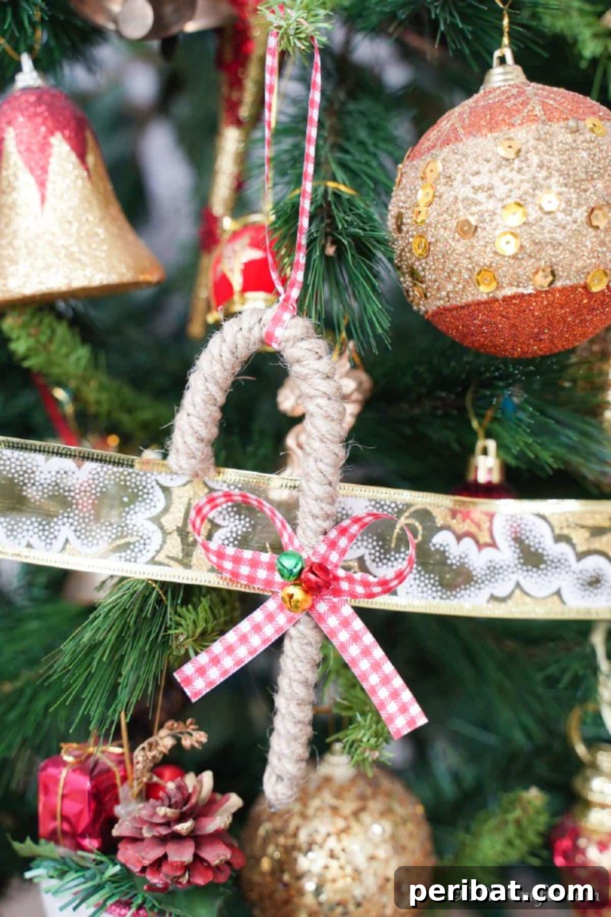 Farmhouse Jute Candy Cane Bauble 14 Candy cane ornament hanging on the tree